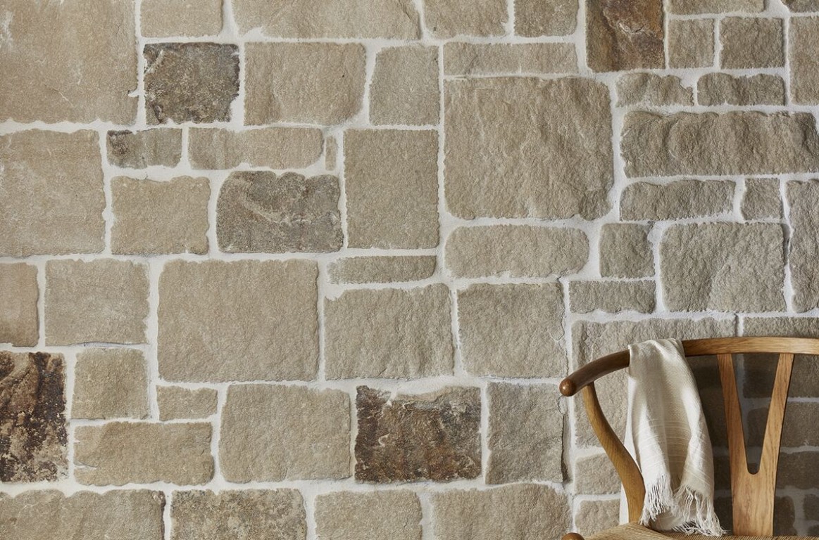 Custom natural stone masonry creating distinctive architectural features and interior accent walls