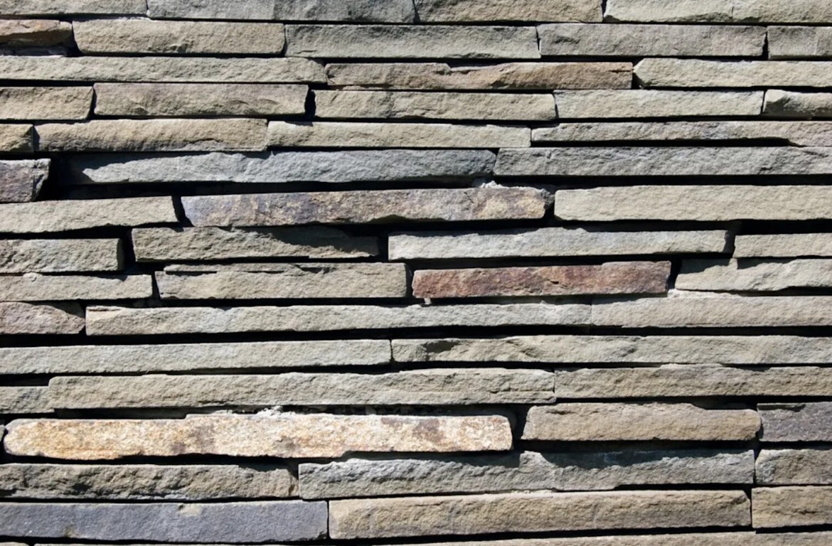 Stone veneer siding and exterior installation providing elegant facade upgrades for homes